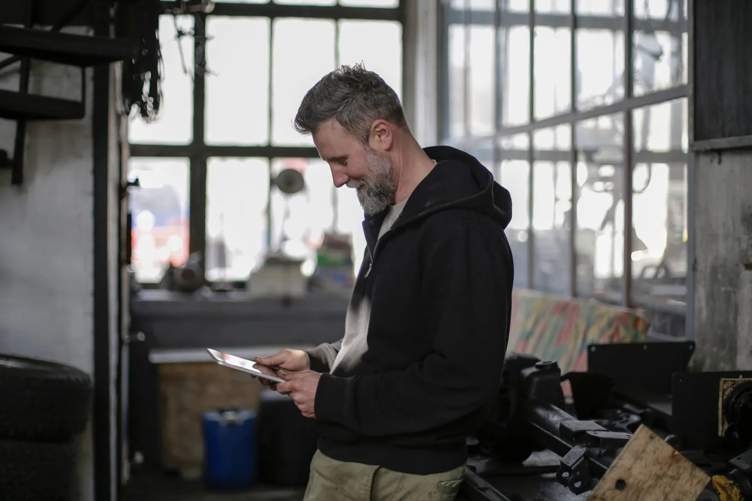 A technician logging on a tablet the job he has just finished