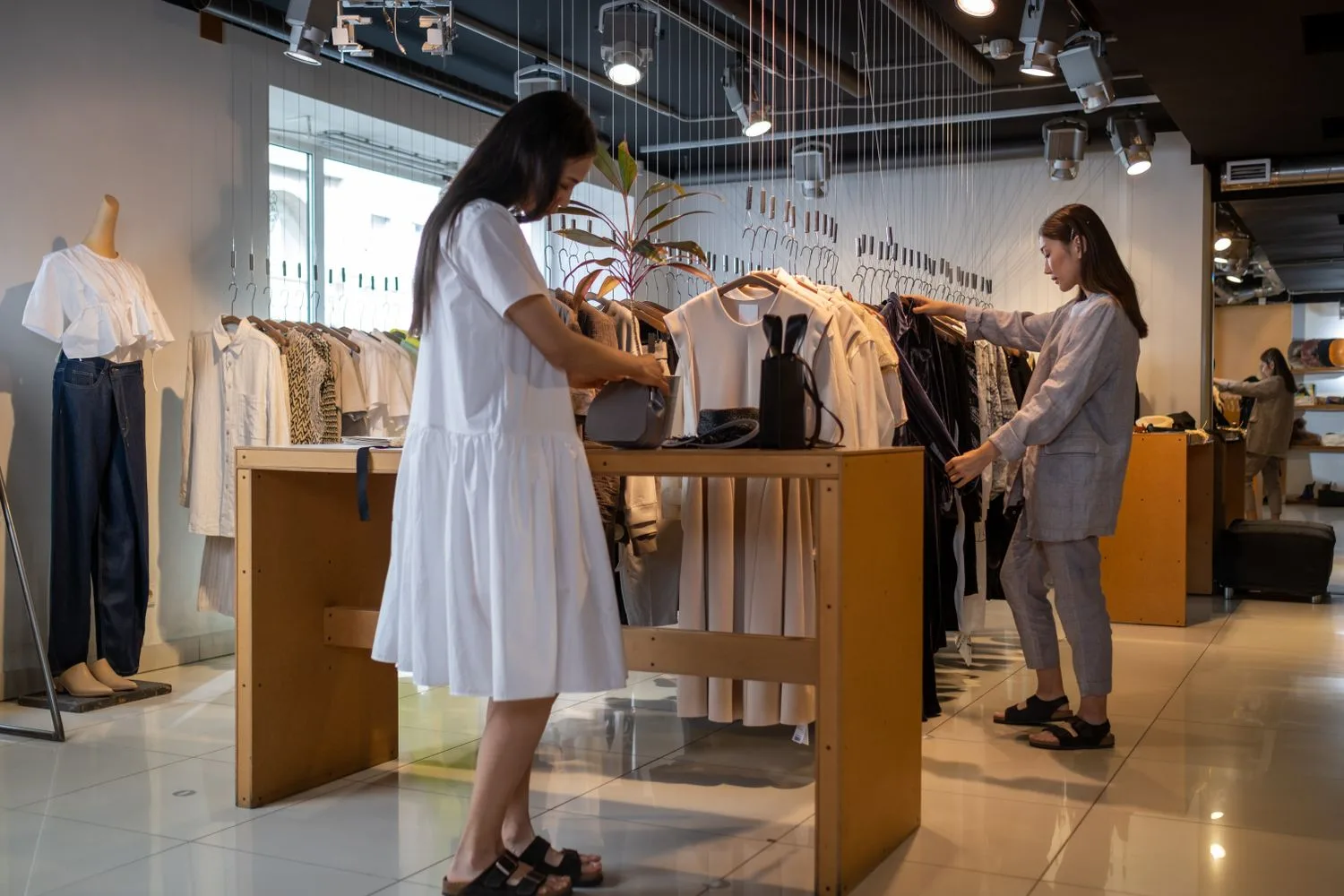 Shop owner arranging the new product on the display table