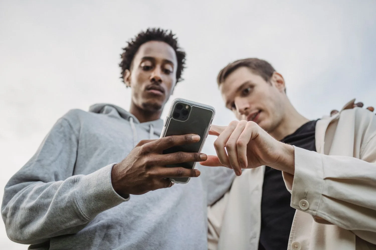 Two people looking at a link somebody has just sent them