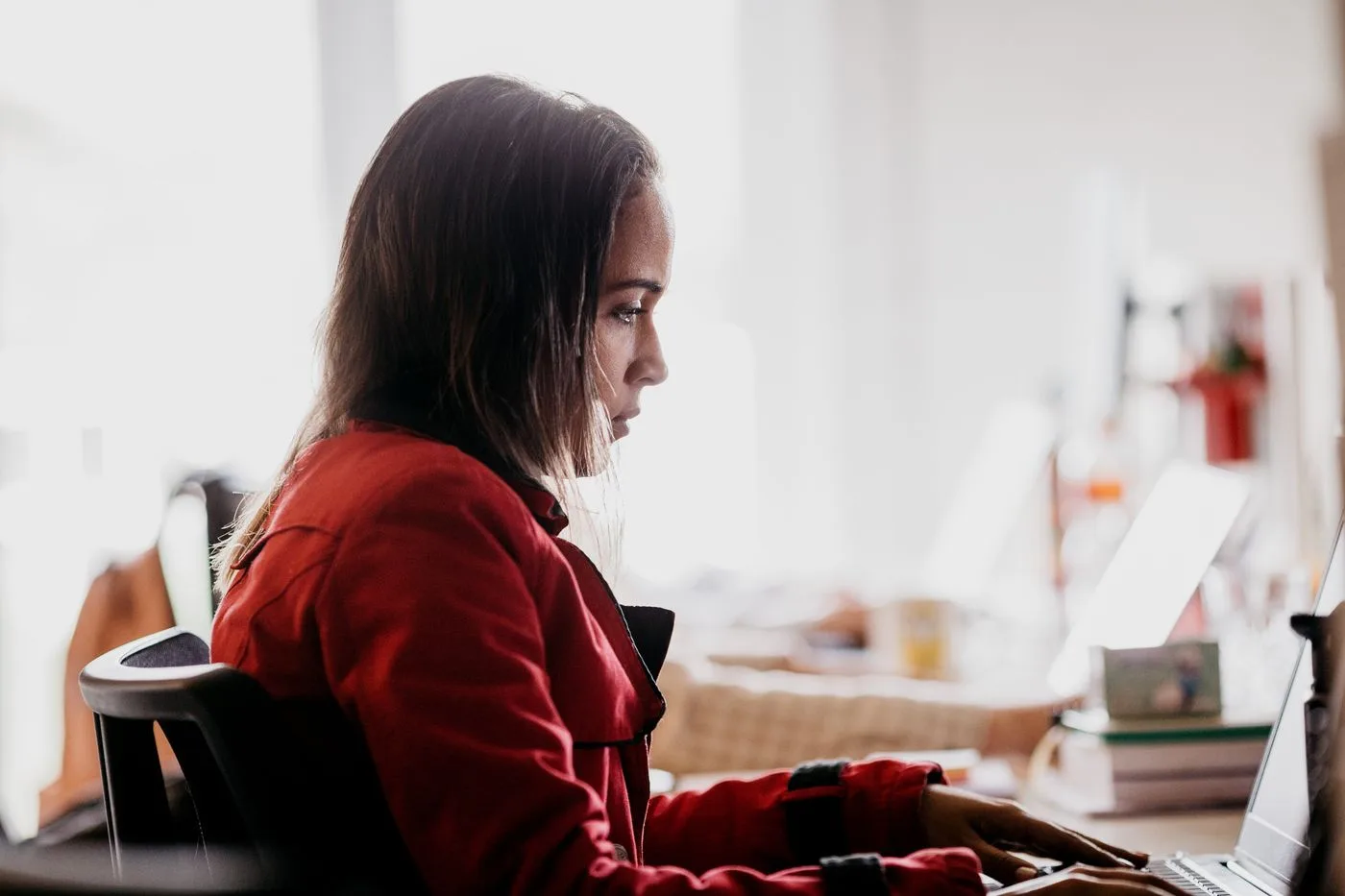A professional reviewing how their business ranking is doing on the computer each month