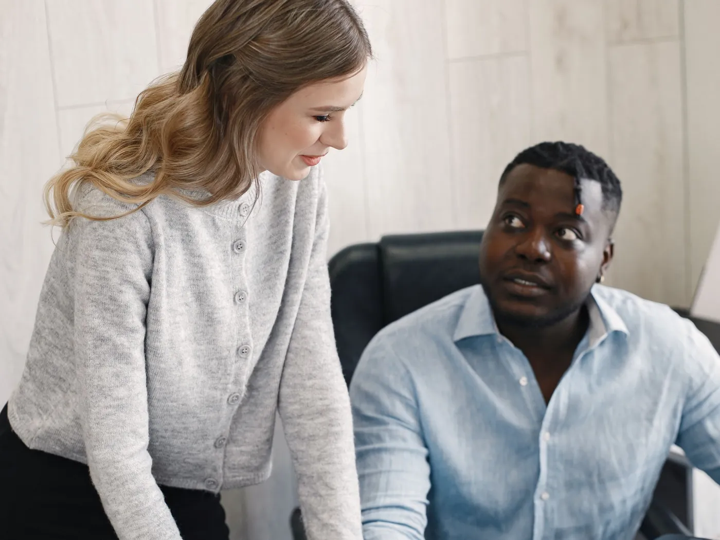 Two people reviewing custom software on screen before putting it into production