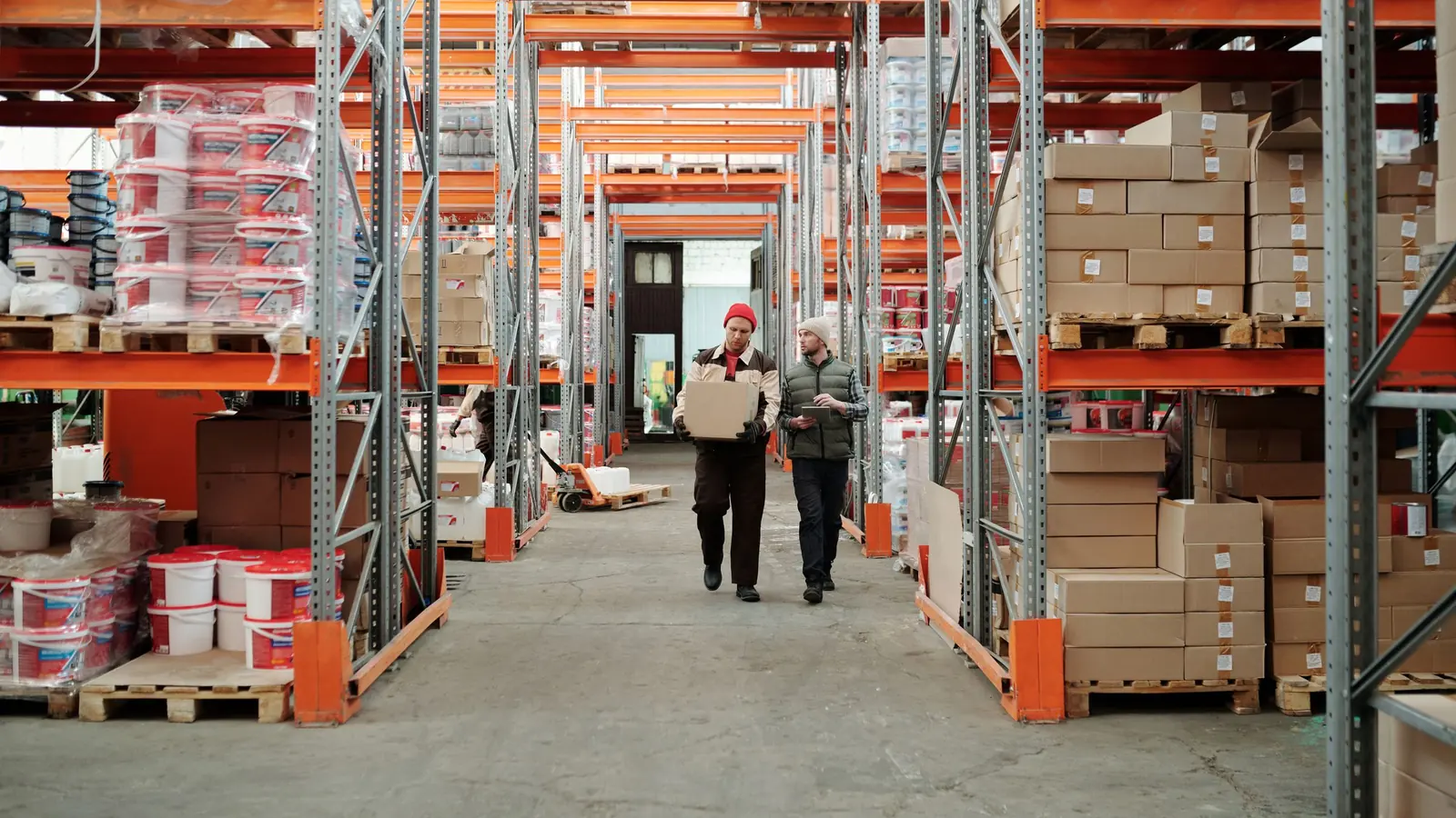 A mid-sized company warehouse with shelving and boxes, the kind of Badalona business that outgrows its software